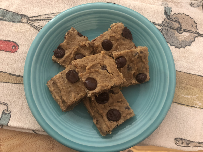 Gluten Free Vegan Blondie with chocolate chips plated and on a tea towel